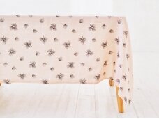 Softened linen tablecloth „Su pūkeliais”, soft coral pink color